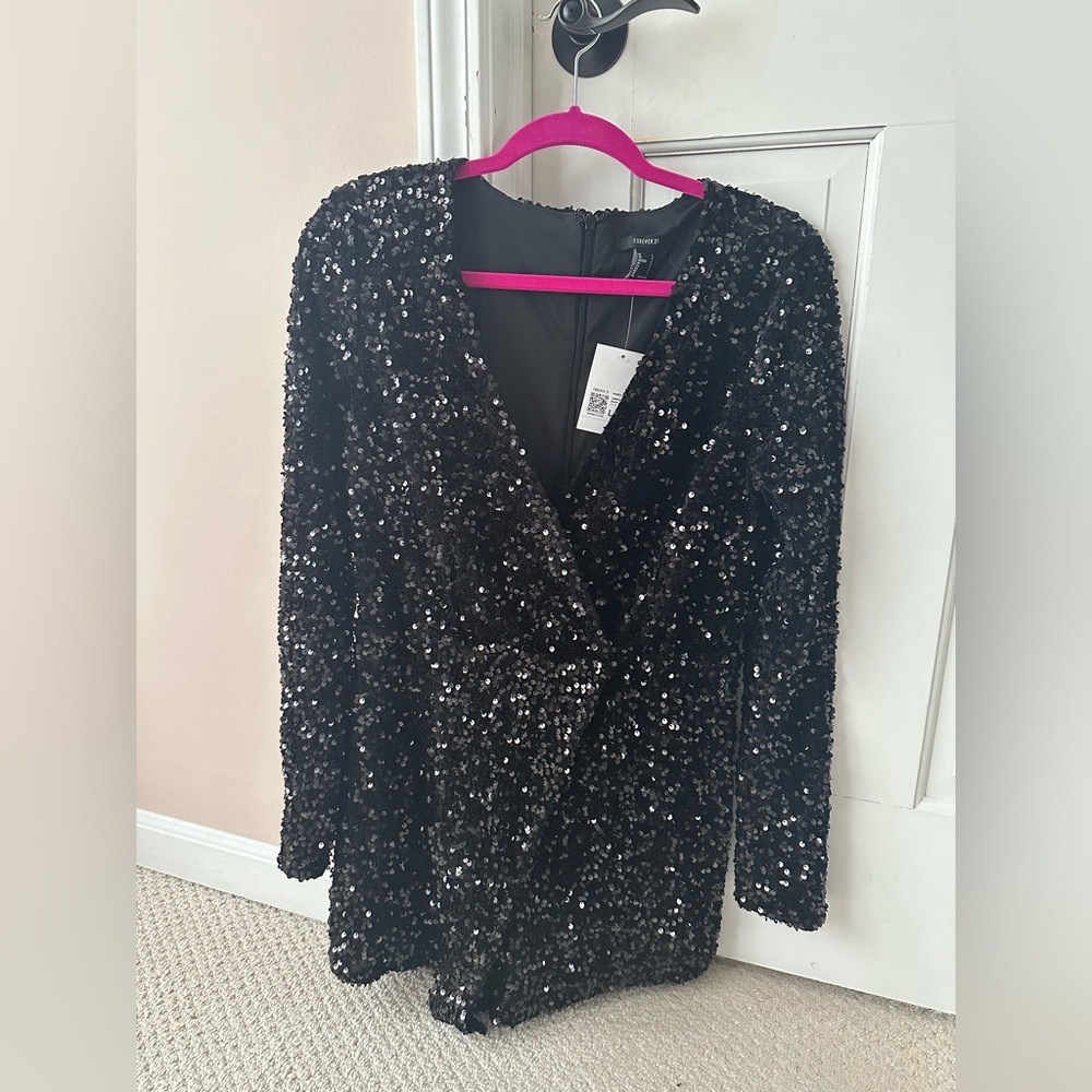 Brand new romper. Just in time for the holidays. Sequin Plunging Romper.